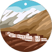 Circular illustration of a small village nestled beneath brown hills and snowy mountain peaks.